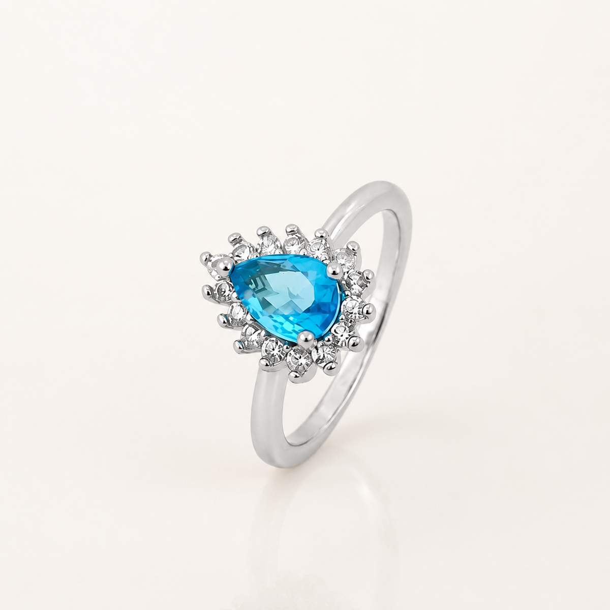 Anel Folheado a Ouro 18k e Prata Gota Cravejada Azul