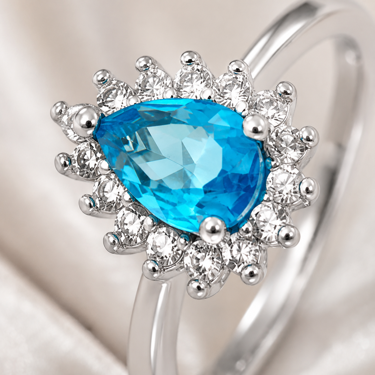 Anel Folheado a Ouro 18k e Prata Gota Cravejada Azul